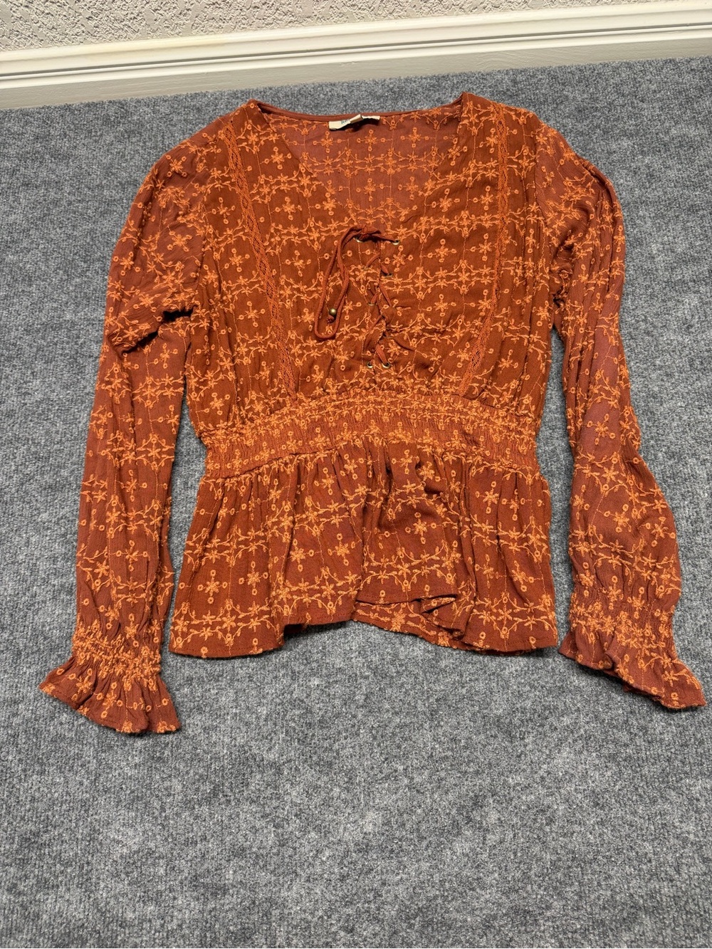 Rockin C Embroidered Tie-Neck Peplum Blouse in Rust